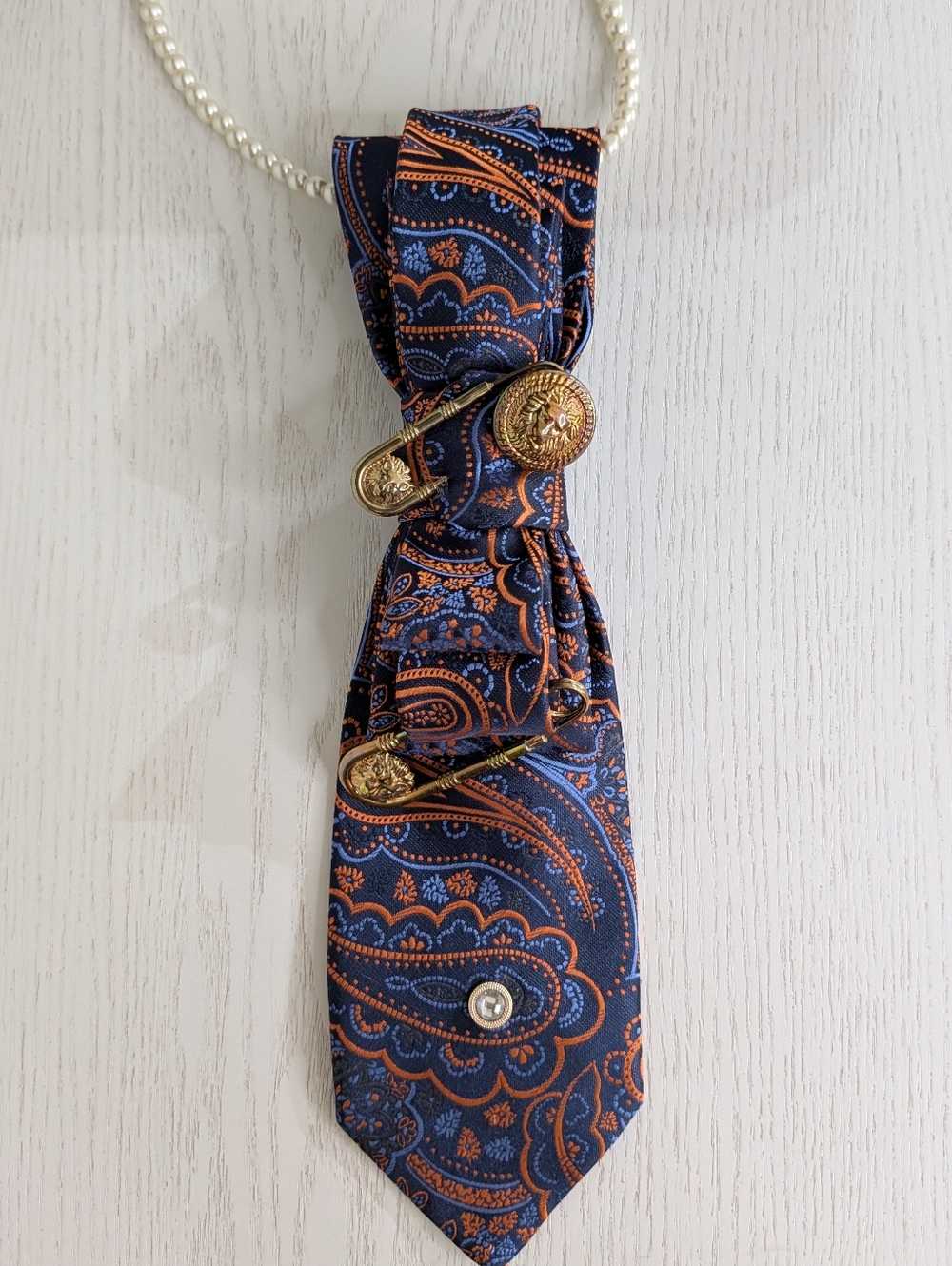 Elegant Navy Blue & Orange Paisley Pendant Necklace with Gold Accents
Handmade